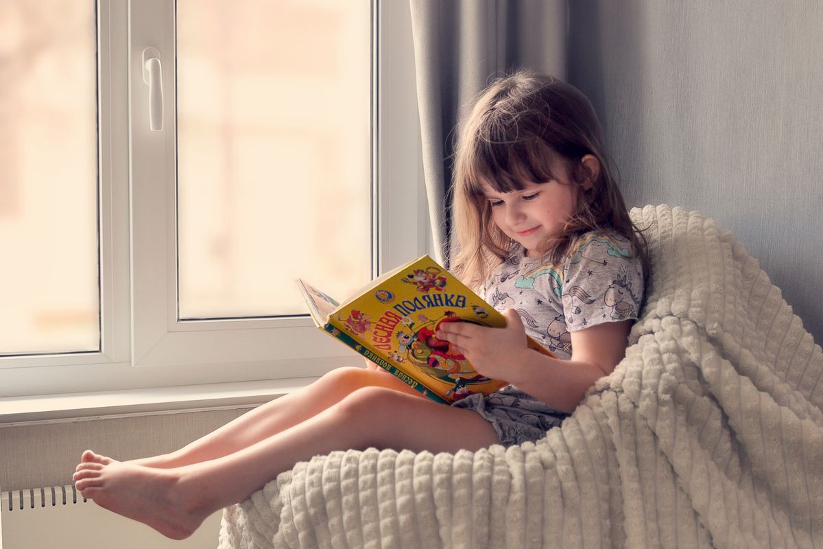 A child reading by the window - Photo by Ольга Жарикова on Pexels