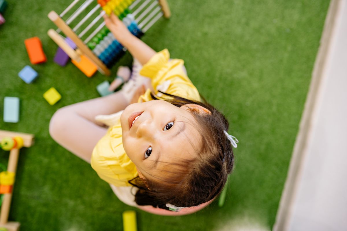 Happy child playing with abacus indoors. Perfect for educational and playful themes. - Photo by Yan Krukau on Pexels